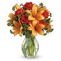 Deliver Rakhi with Orange Lily Red Roses Flowers to India