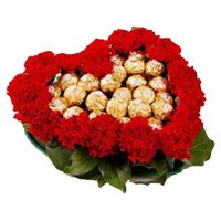 Rahki Gifts to India with 24 Red Carnation 24 Ferrero Rocher Heart Arrangement
