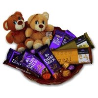 Online Rakhi with Twin Teddy Basket of Chocolates in Imdia