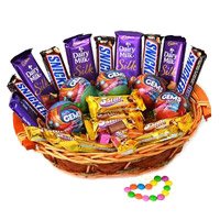 Online Rakhi Gift Delivery to India that includes Cadbury Snicker Chocolate Basket on Rakhi