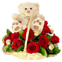 Send Rakhi Gifts in India with 12 Red Roses, 10 Ferrero Rocher and 9 Inch Teddy Basket With Rakhi