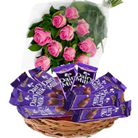 Place Order for Rakhi and Dairy Milk Basket 12 Chocolates With 12 Pink Roses in India