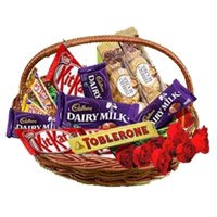 Deliver Rakhi with Basket of Assorted Chocolate to India and 10 Red Roses