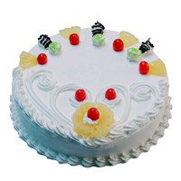 Send Rakhi with 500 gm Eggless Pineapple Rakhi Cakes to India